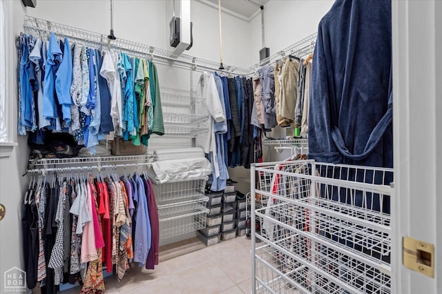 spacious closet with tile patterned floors