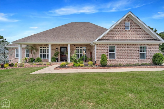 4260 Weldon Cv, Jonesboro, AR 72404 - back of property with brick siding, a yard, a shingled roof, and a porch