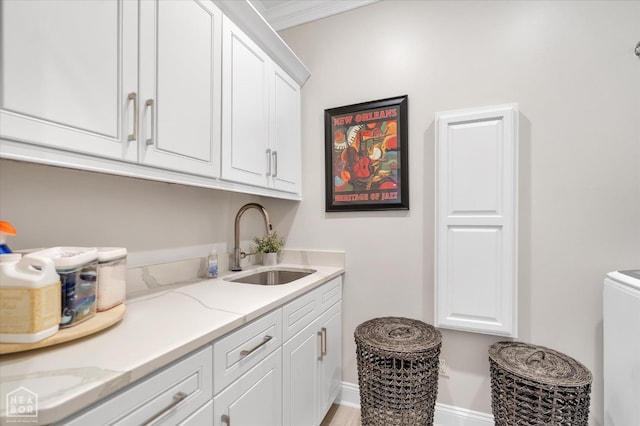 4260 Weldon Cv, Jonesboro, AR 72404 - washroom with cabinet space, baseboards, and crown molding