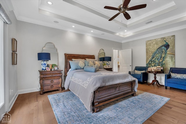 4260 Weldon Cv, Jonesboro, AR 72404 - bedroom with a tray ceiling, wood finished floors, baseboards, ornamental molding, and recessed lighting