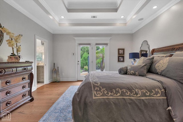 4260 Weldon Cv, Jonesboro, AR 72404 - bedroom featuring access to exterior, light wood finished floors, baseboards, ensuite bath, and a raised ceiling