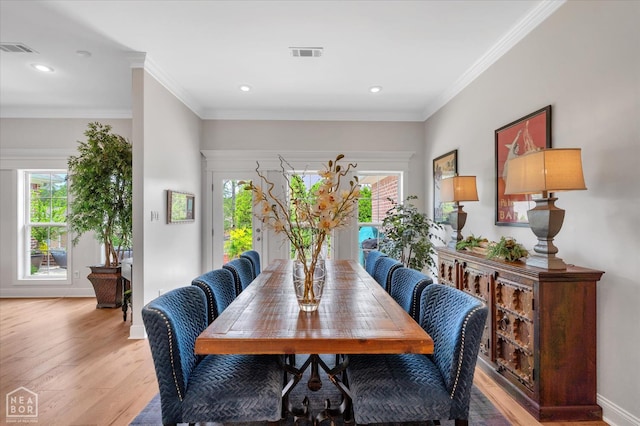 4260 Weldon Cv, Jonesboro, AR 72404 - dining room featuring healthy amount of natural light, light wood-style floors, ornamental molding, recessed lighting, and baseboards