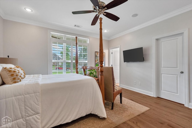 4260 Weldon Cv, Jonesboro, AR 72404 - bedroom featuring wood finished floors, crown molding, baseboards, recessed lighting, and ceiling fan