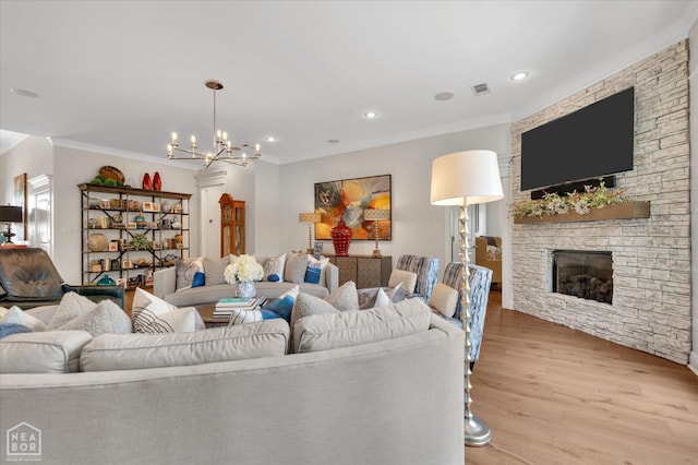 4260 Weldon Cv, Jonesboro, AR 72404 - living area featuring ornamental molding, a chandelier, light wood-style floors, a fireplace, and recessed lighting
