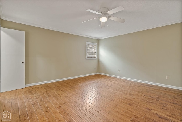 unfurnished room featuring light wood-type flooring, ornamental molding, baseboards, and a ceiling fan