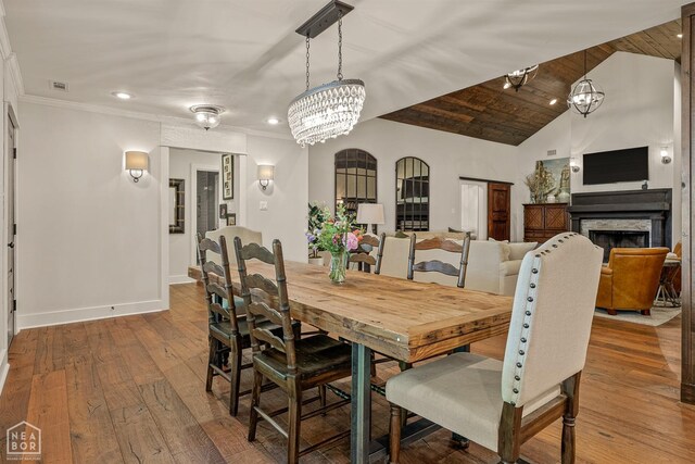803 Fairway Dr, Jonesboro, AR 72401 - dining space with baseboards, recessed lighting, hardwood / wood-style flooring, and a fireplace