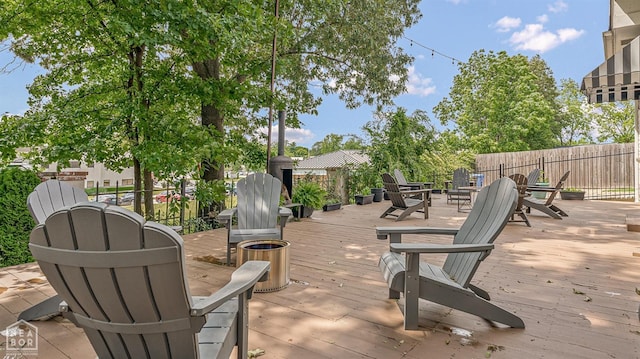 803 Fairway Dr, Jonesboro, AR 72401 - wooden terrace featuring an outdoor fire pit and fence