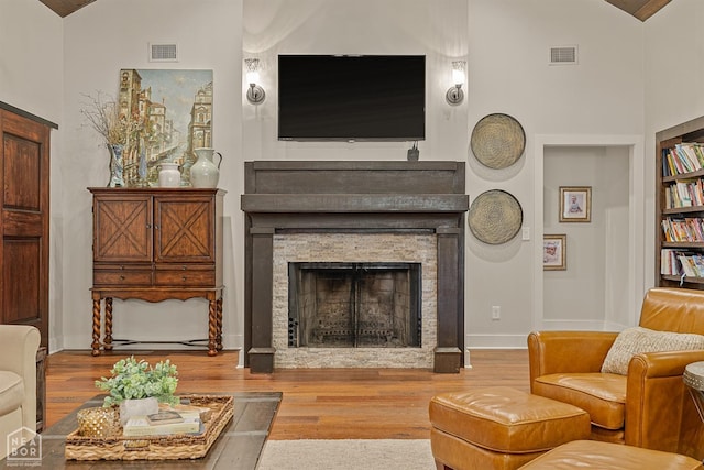 803 Fairway Dr, Jonesboro, AR 72401 - living area featuring a fireplace, visible vents, built in features, and wood finished floors