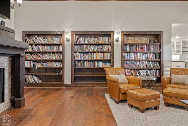 803 Fairway Dr, Jonesboro, AR 72401 - living area with a fireplace, built in features, and hardwood / wood-style floors