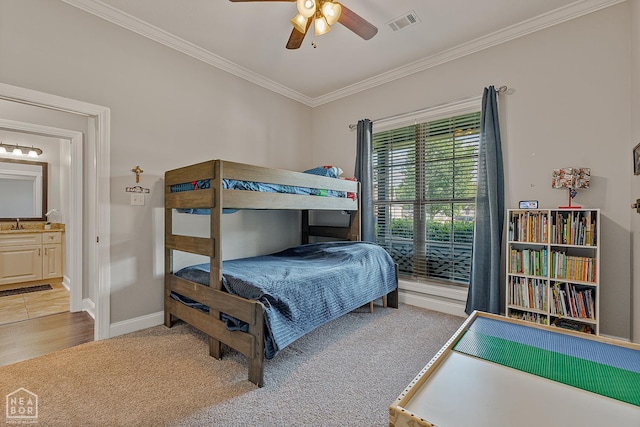 3293 Abigail Ct, Jonesboro, AR 72404 - carpeted bedroom with crown molding, baseboards, ceiling fan, and ensuite bathroom