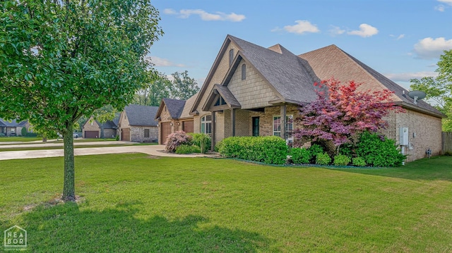 3293 Abigail Ct, Jonesboro, AR 72404 - view of front facade featuring driveway, brick siding, a front lawn, roof with shingles, and an attached garage