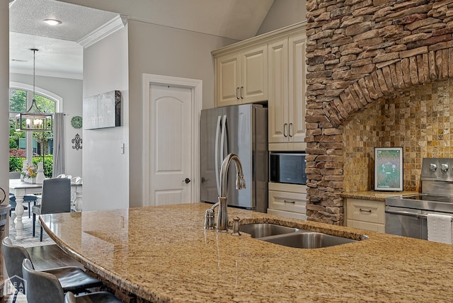 3293 Abigail Ct, Jonesboro, AR 72404 - kitchen with stainless steel appliances, a sink, light stone counters, hanging light fixtures, and a breakfast bar