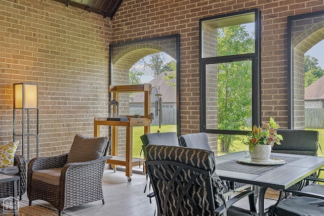 3293 Abigail Ct, Jonesboro, AR 72404 - sunroom / solarium with healthy amount of natural light, outdoor dining space, and vaulted ceiling