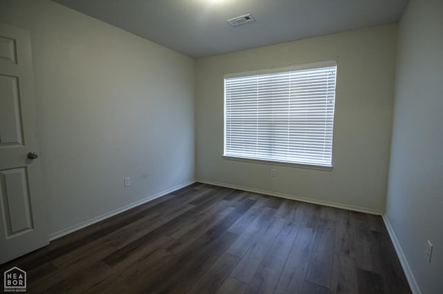 2404 Judes Ct, Jonesboro, AR 72404 - unfurnished room with dark wood-style flooring and baseboards