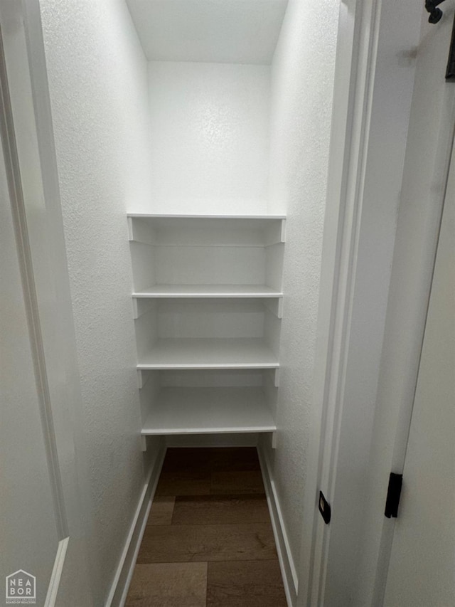 100 Lenford Dr, Bono, AR 72416 - walk in closet with wood finished floors