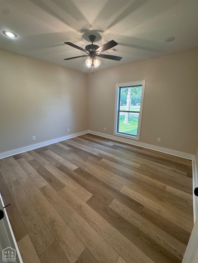 100 Lenford Dr, Bono, AR 72416 - empty room with wood-type flooring, ceiling fan, baseboards, and recessed lighting