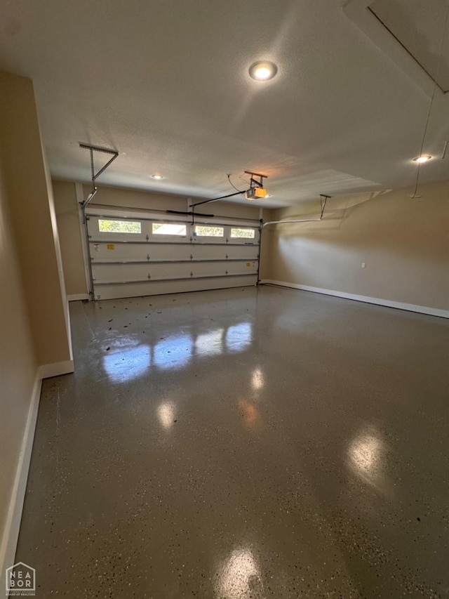 100 Lenford Dr, Bono, AR 72416 - garage featuring baseboards, a garage door opener, and recessed lighting