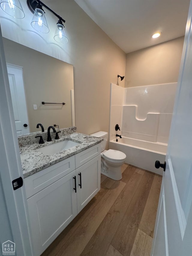 100 Lenford Dr, Bono, AR 72416 - full bath featuring wood finished floors, vanity, washtub / shower combination, and toilet