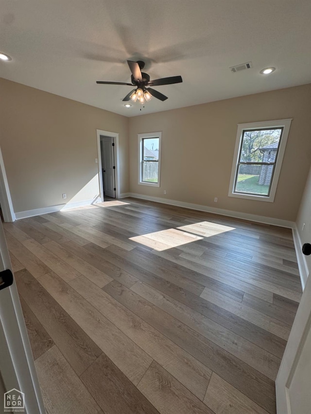 100 Lenford Dr, Bono, AR 72416 - unfurnished room featuring wood finished floors, baseboards, recessed lighting, and a ceiling fan