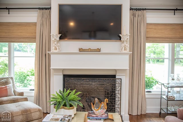 1105 Cardinal Rd, Jonesboro, AR 72401 - living area with a fireplace and wood finished floors