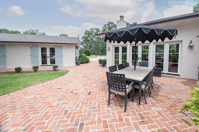 1105 Cardinal Rd, Jonesboro, AR 72401 - view of patio / terrace featuring french doors and outdoor dining area
