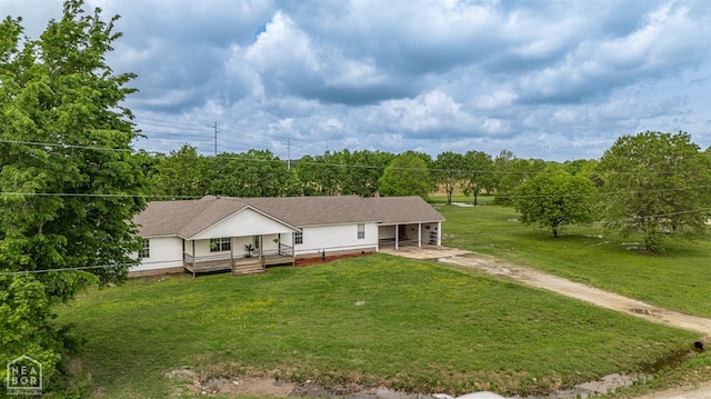 view of front of home with a front lawn, driveway, and covered porch
