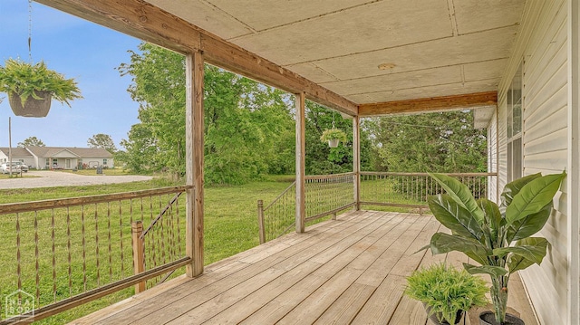 wooden deck with a yard