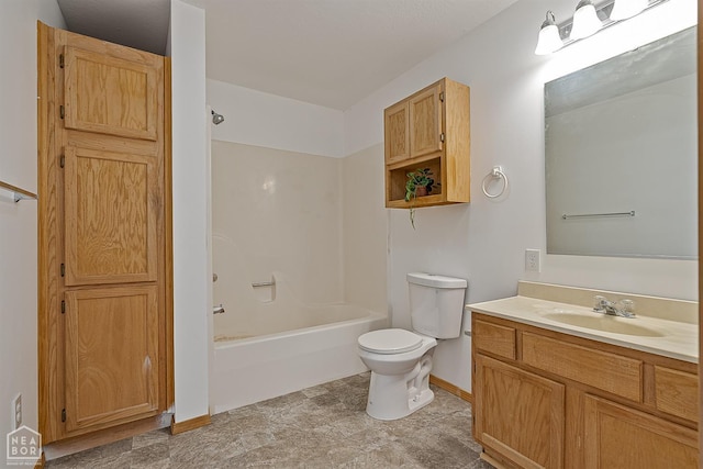 bathroom with toilet, bathtub / shower combination, vanity, and baseboards