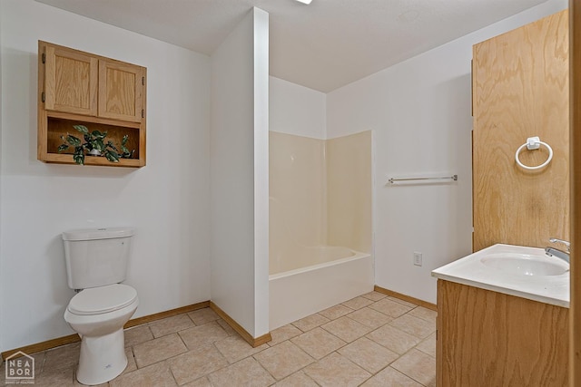 bathroom featuring vanity, toilet, bathtub / shower combination, baseboards, and tile patterned flooring