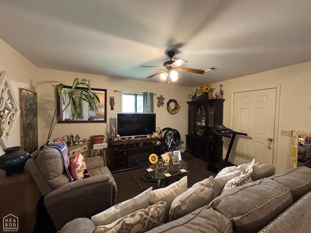 carpeted living area with visible vents and ceiling fan