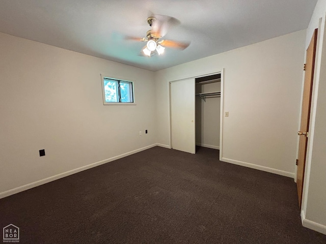 204 SE 4th St E, Walnut Ridge, AR 72476 - unfurnished bedroom featuring baseboards, dark colored carpet, a closet, and ceiling fan