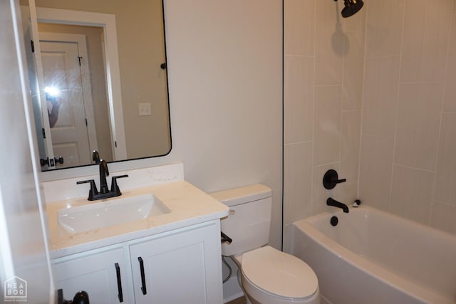 bathroom with toilet, vanity, and bathtub / shower combination
