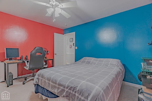 carpeted bedroom with ceiling fan and baseboards