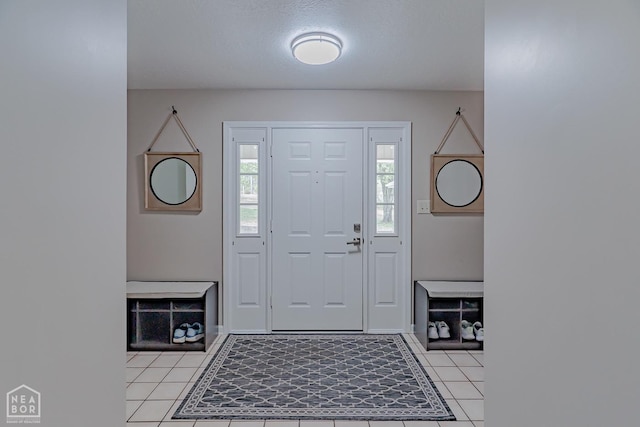 foyer featuring light tile patterned floors