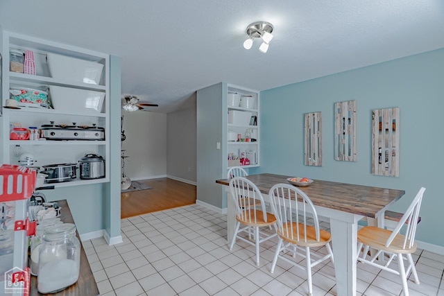 dining area featuring baseboards, a ceiling fan, and light tile patterned flooring