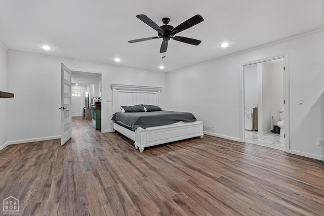 608 Finch Ave, Monette, AR 72447 - bedroom featuring crown molding, wood finished floors, recessed lighting, baseboards, and ensuite bath