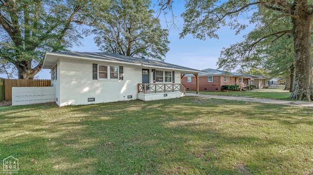 608 Finch Ave, Monette, AR 72447 - view of front of house featuring crawl space, brick siding, and a carport