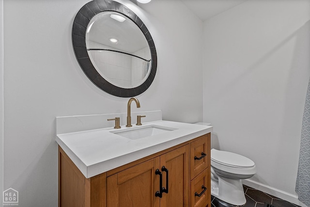 608 Finch Ave, Monette, AR 72447 - full bathroom featuring vanity, toilet, tile patterned floors, baseboards, and a shower with shower curtain