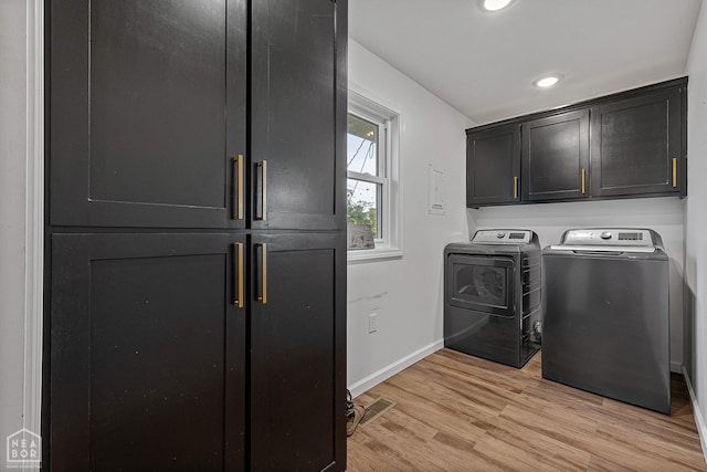 608 Finch Ave, Monette, AR 72447 - washroom with cabinet space, washing machine and dryer, baseboards, light wood-style flooring, and recessed lighting