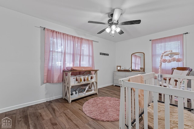 608 Finch Ave, Monette, AR 72447 - bedroom with multiple windows, wood finished floors, baseboards, and ceiling fan