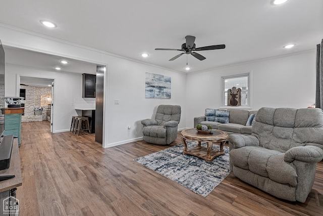 608 Finch Ave, Monette, AR 72447 - living area with ceiling fan, crown molding, wood finished floors, baseboards, and recessed lighting