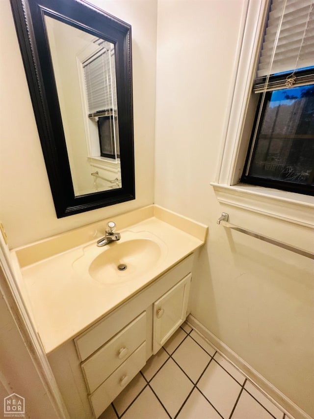2208 John Cir, Newport, AR 72112 - bathroom with tile patterned flooring, vanity, and baseboards