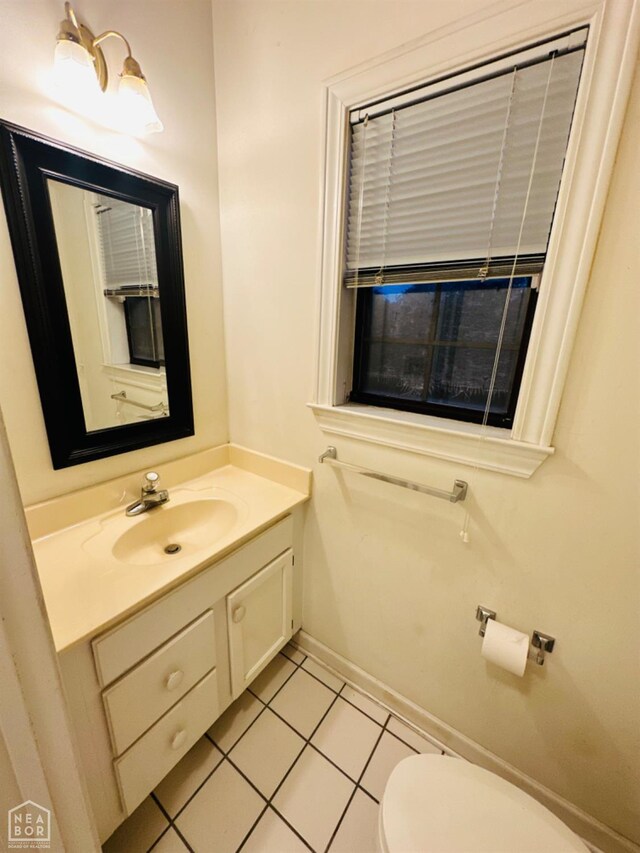 2208 John Cir, Newport, AR 72112 - half bathroom with toilet, vanity, baseboards, and tile patterned flooring