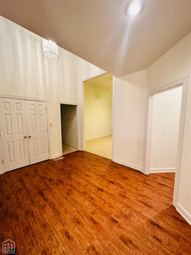 2208 John Cir, Newport, AR 72112 - interior space featuring wood finished floors, an inviting chandelier, and baseboards