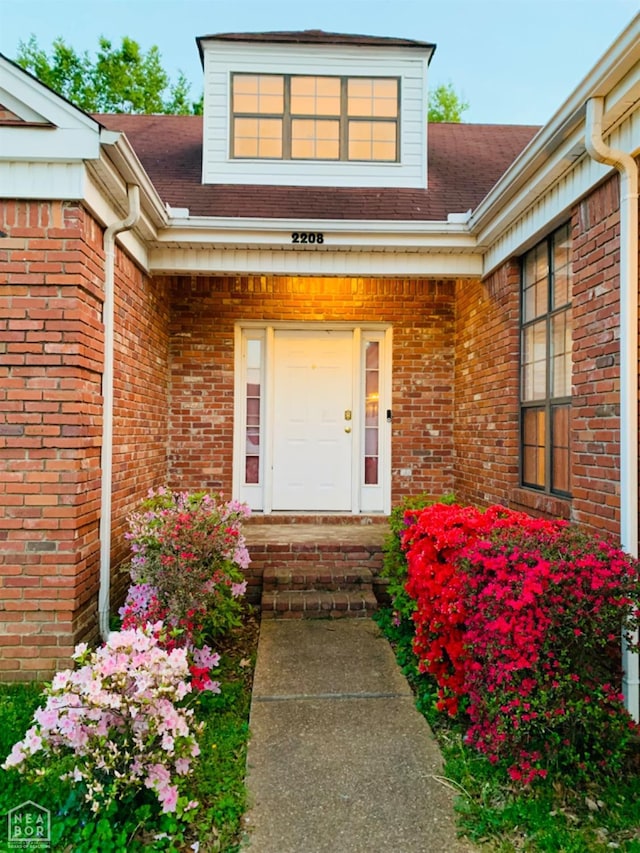 2208 John Cir, Newport, AR 72112 - view of exterior entry featuring brick siding