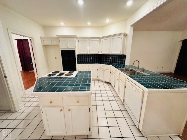 2208 John Cir, Newport, AR 72112 - kitchen featuring tile counters, white appliances, a center island, backsplash, and a sink