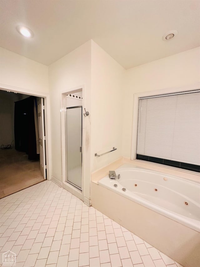 2208 John Cir, Newport, AR 72112 - bathroom with a stall shower, a tub with jets, and tile patterned flooring