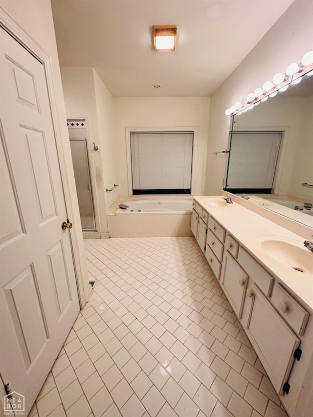 2208 John Cir, Newport, AR 72112 - bathroom featuring tile patterned flooring, double vanity, a bath, and a sink