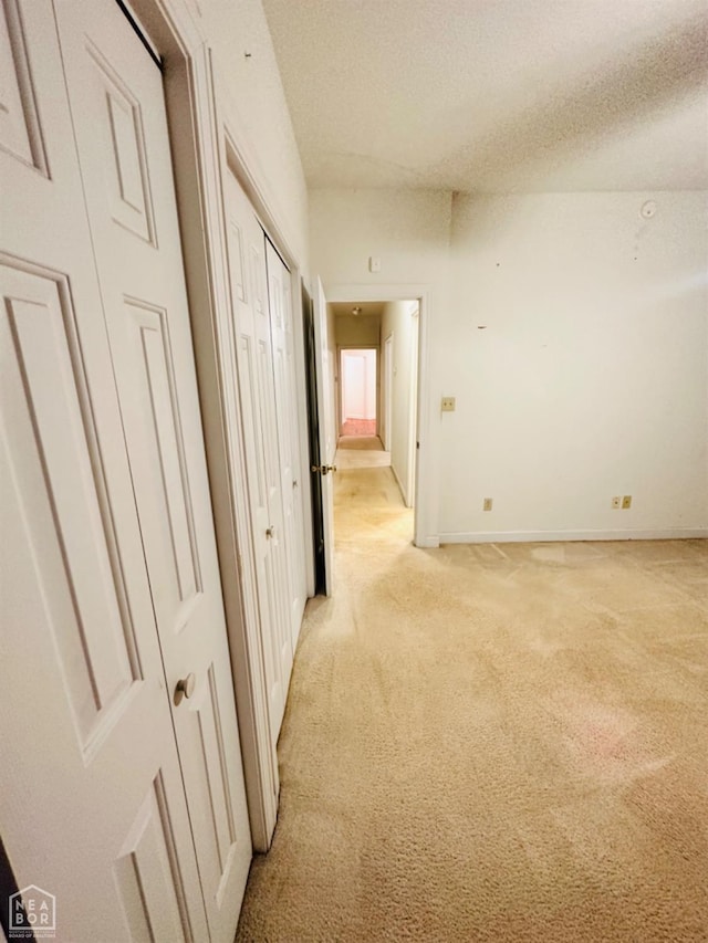 2208 John Cir, Newport, AR 72112 - corridor featuring baseboards, light carpet, and a textured ceiling