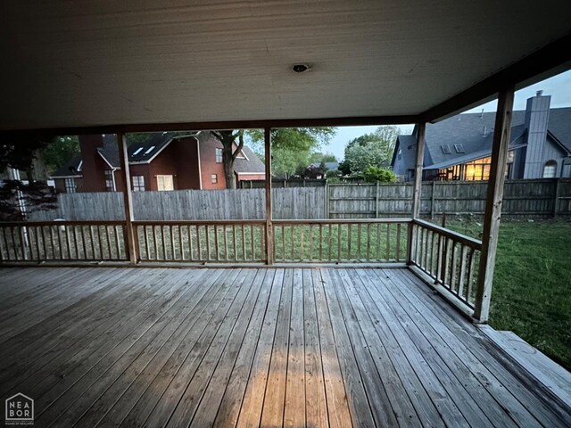 2208 John Cir, Newport, AR 72112 - wooden deck with a fenced backyard and a lawn